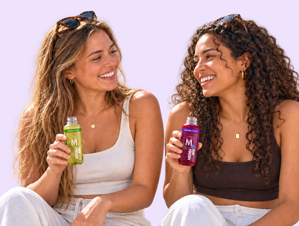 Two friends holding Moringa Man Original and Blueberry with the caps off